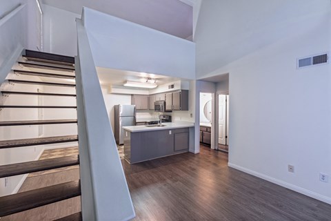 a kitchen and stairs in a 555 waverly unit a kitchen and stairs in a 555 waverly unit at Villa Mondavi, California